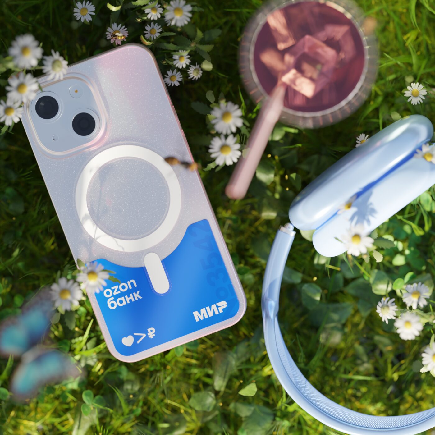 Phone in grass with daisies and headphones
