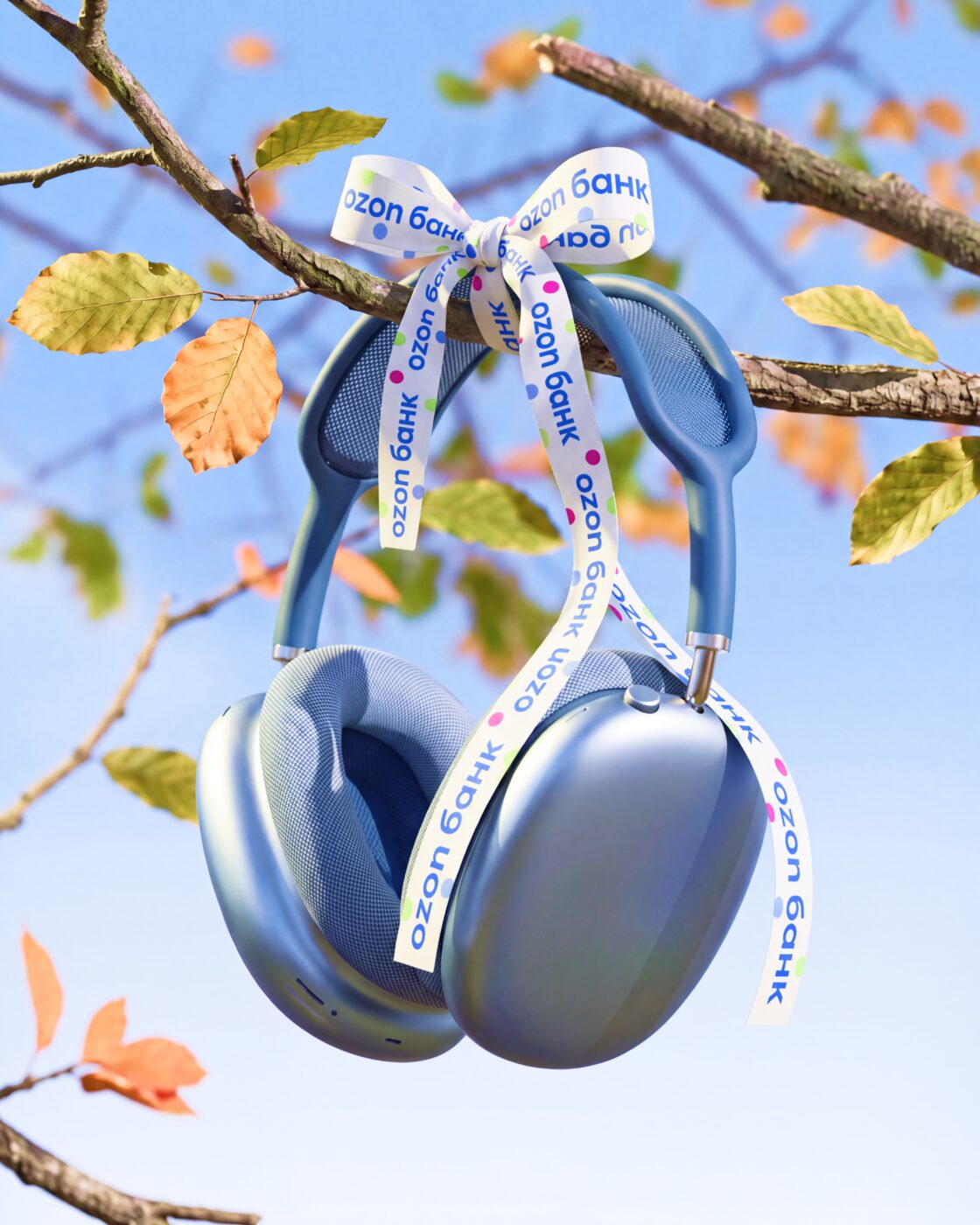 Headphones tied with Ozon Bank ribbon on a branch