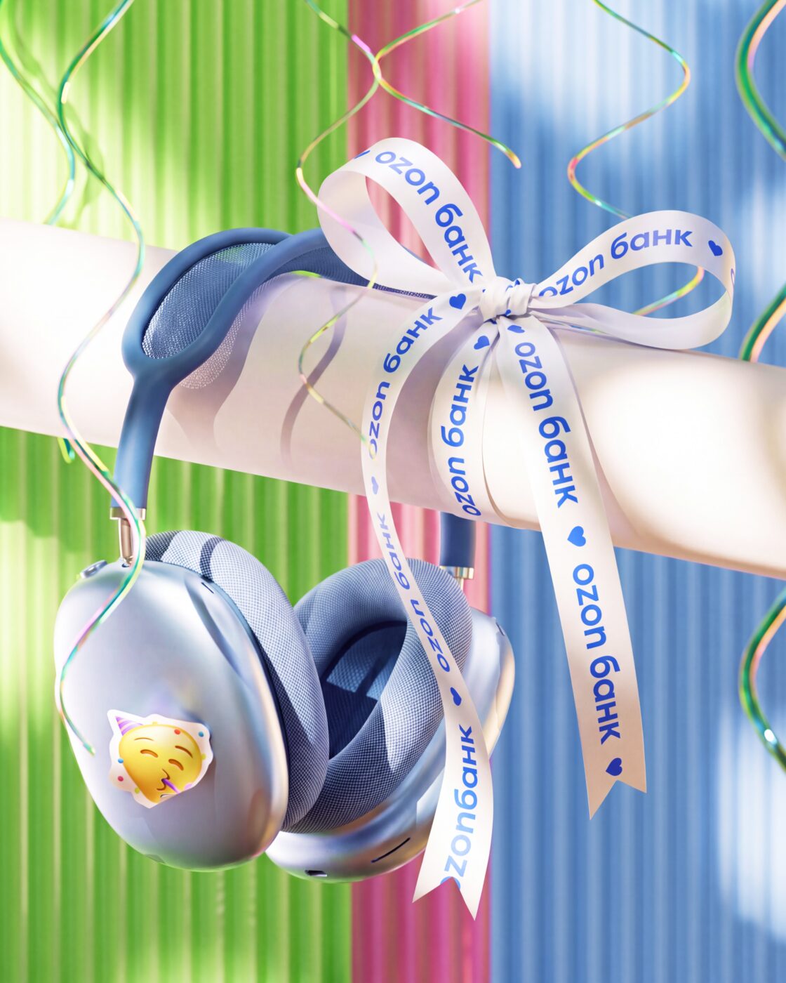 Headphones with a party sticker and ribbons
